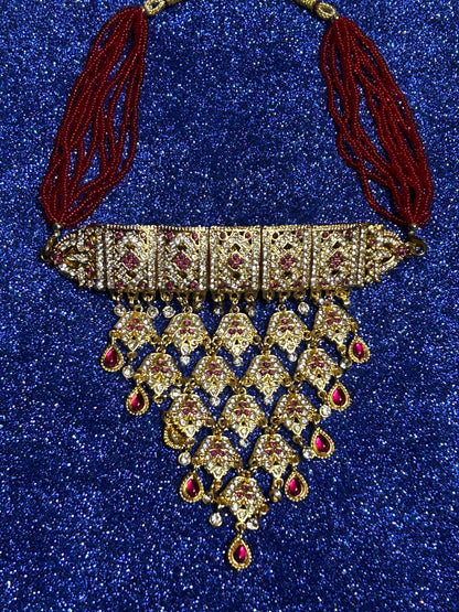 Red kundan and diamond necklace set with tops