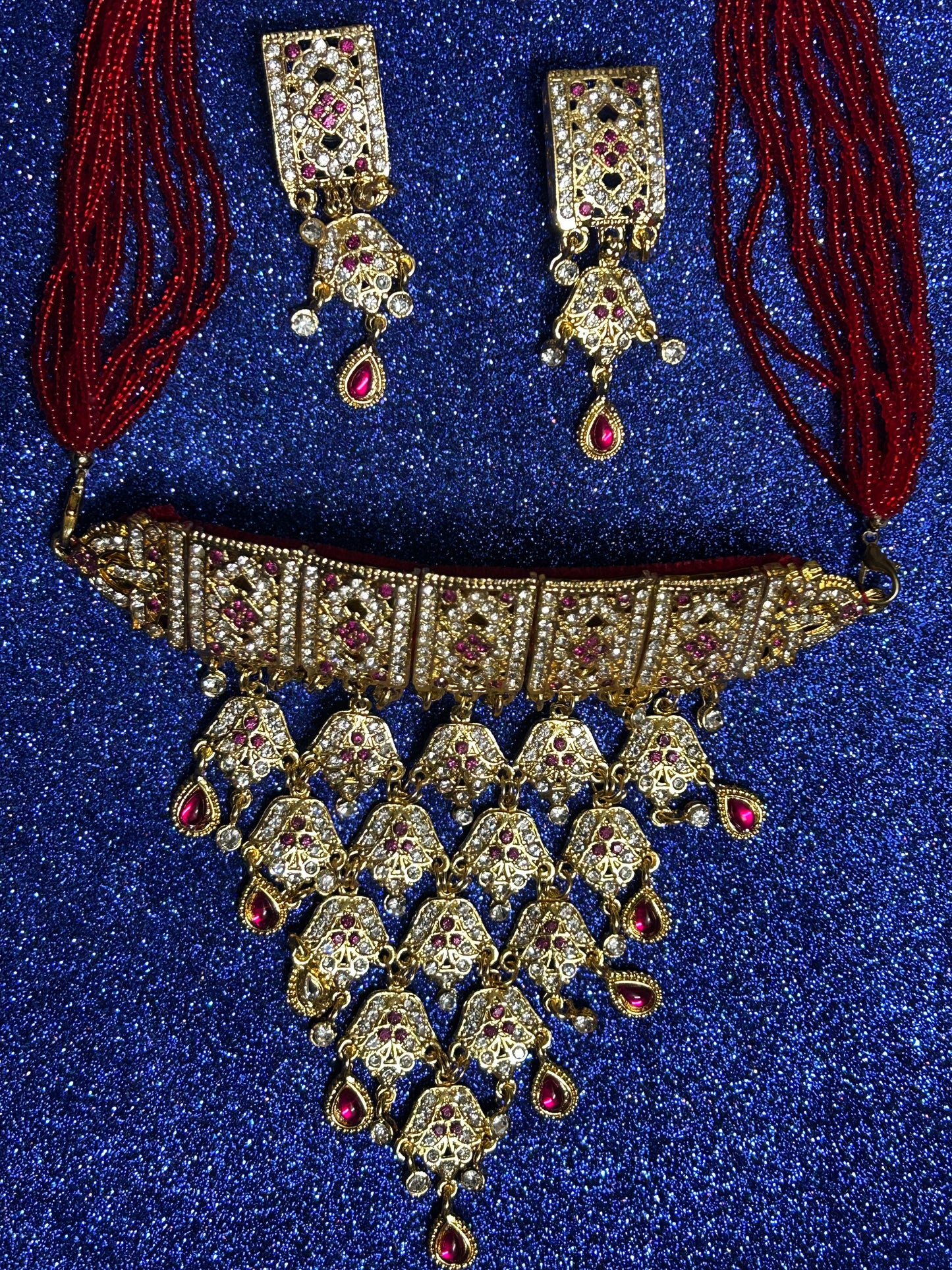 Red kundan and diamond necklace set with tops
